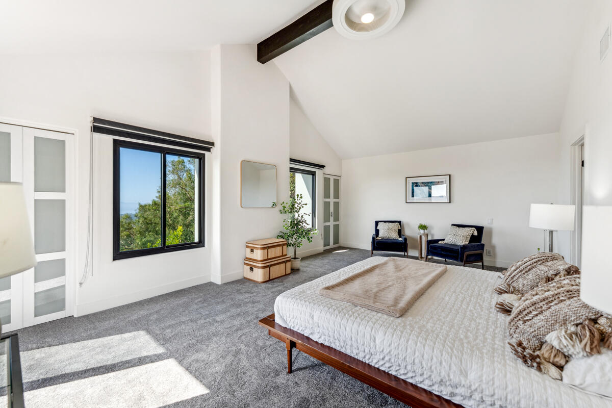 2870 Holly Road Santa Barbara, CA 93105 - Photo 24 of 39 a bedroom with a large bed and a window