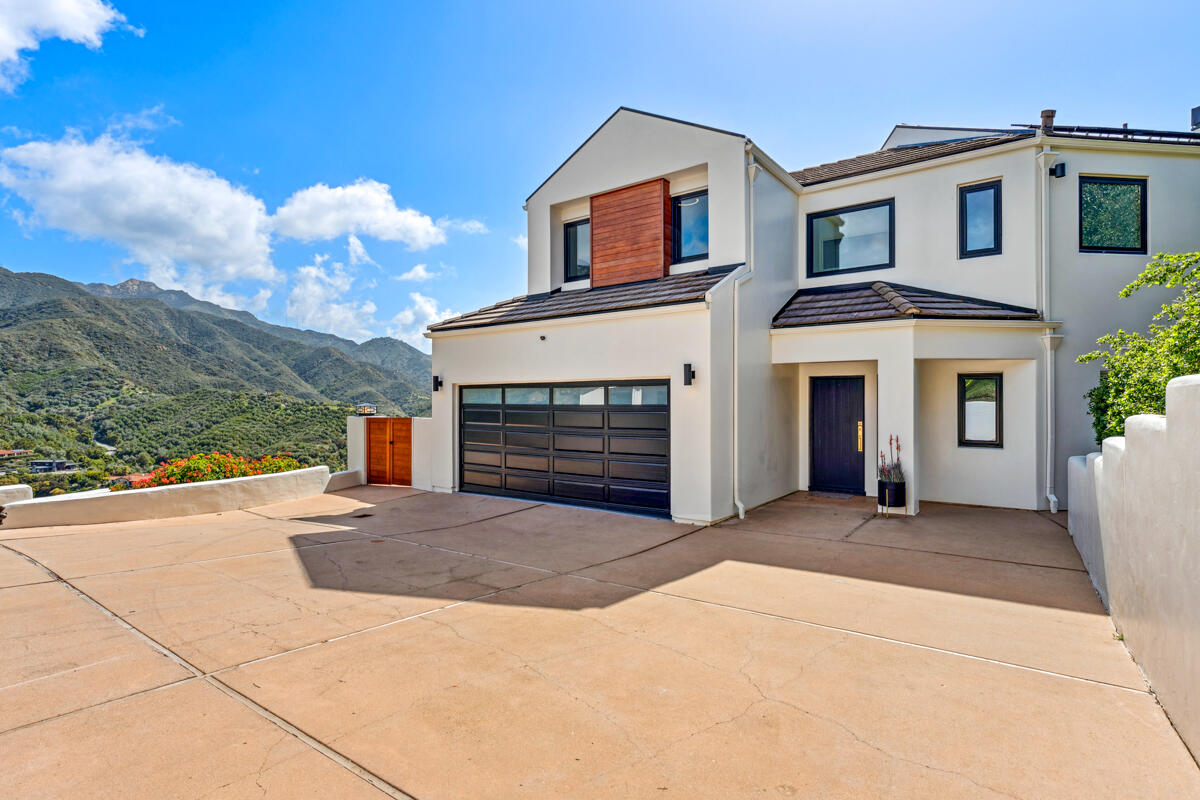 2870 Holly Road Santa Barbara, CA 93105 - Photo 3 of 39 a front view of a house with a yard and garage
