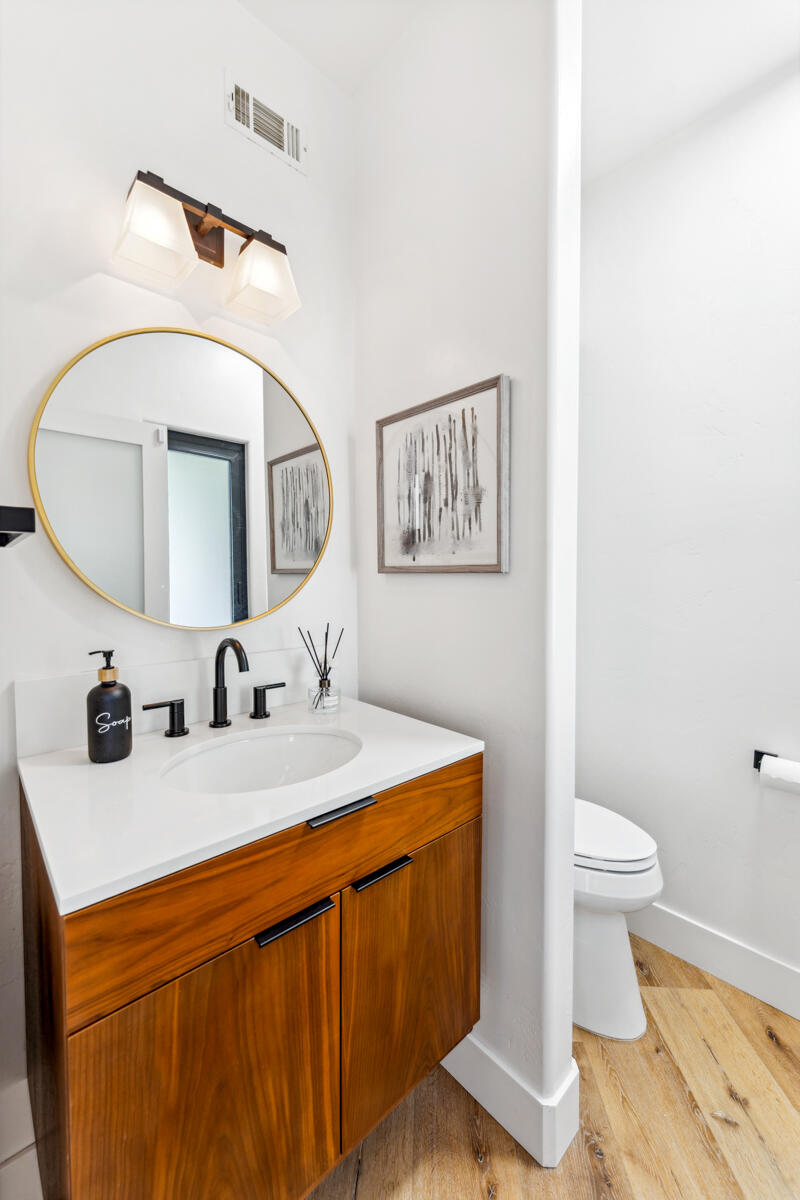 2870 Holly Road Santa Barbara, CA 93105 - Photo 32 of 39 a bathroom with a toilet sink and mirror
