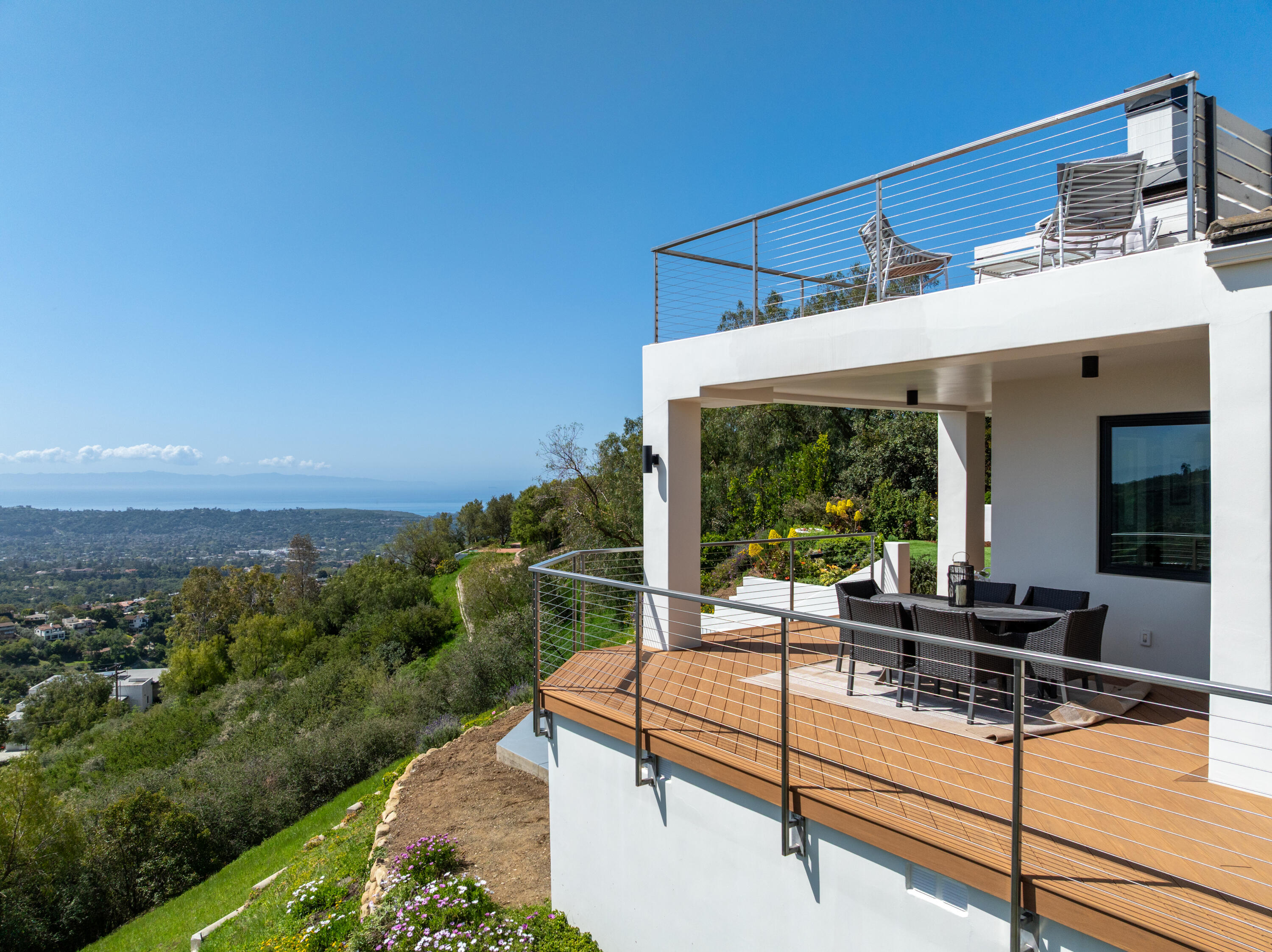 2870 Holly Road Santa Barbara, CA 93105 - Photo 6 of 39 a view of a patio with table and chairs with wooden floor and fence