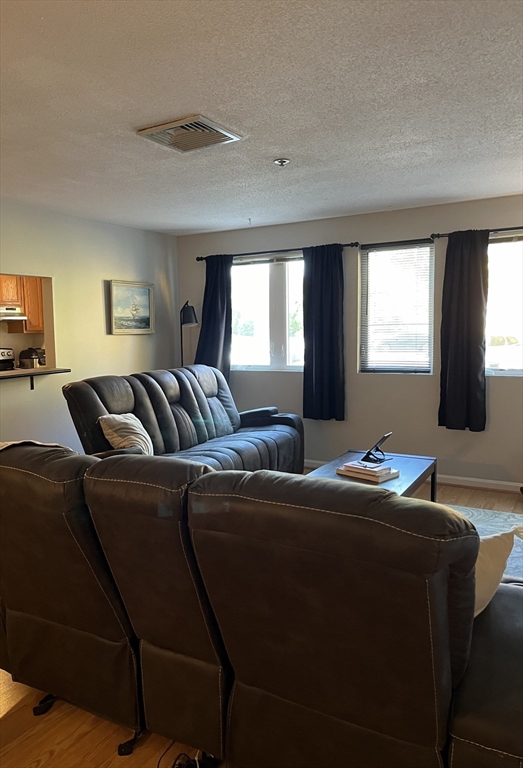 38 Dunham Road, Unit 109 Beverly, MA 01915 - Photo 11 of 24 a hotel room with two beds and a couch