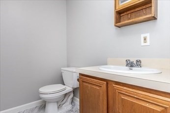 38 Dunham Road, Unit 109 Beverly, MA 01915 - Photo 20 of 24 a bathroom with a sink and a toilet