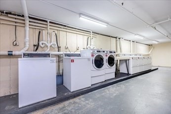 38 Dunham Road, Unit 109 Beverly, MA 01915 - Photo 22 of 24 a utility room with dryer and washer