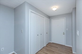 38 Dunham Road, Unit 109 Beverly, MA 01915 - Photo 4 of 24 a view of hallway with closet area