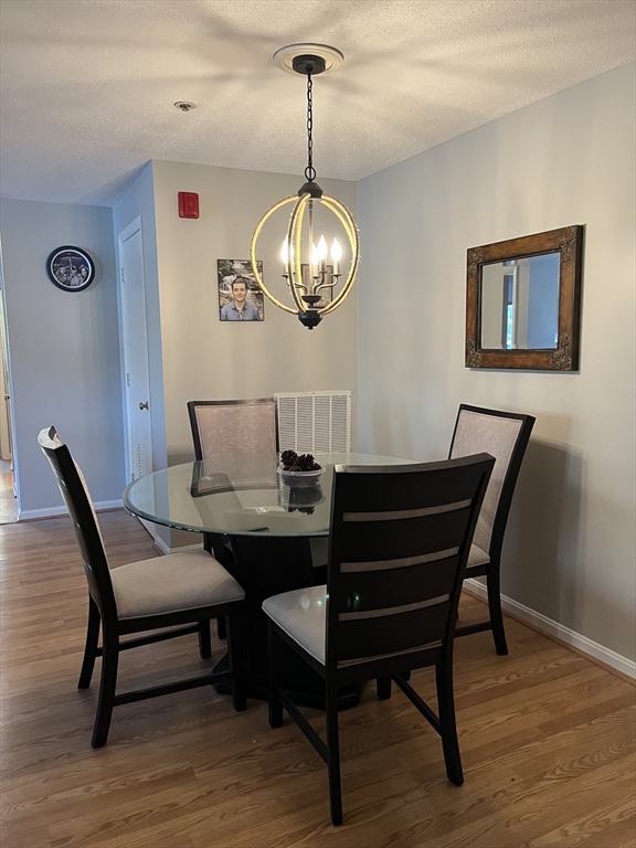 38 Dunham Road, Unit 109 Beverly, MA 01915 - Photo 8 of 24 a view of a dining room with furniture