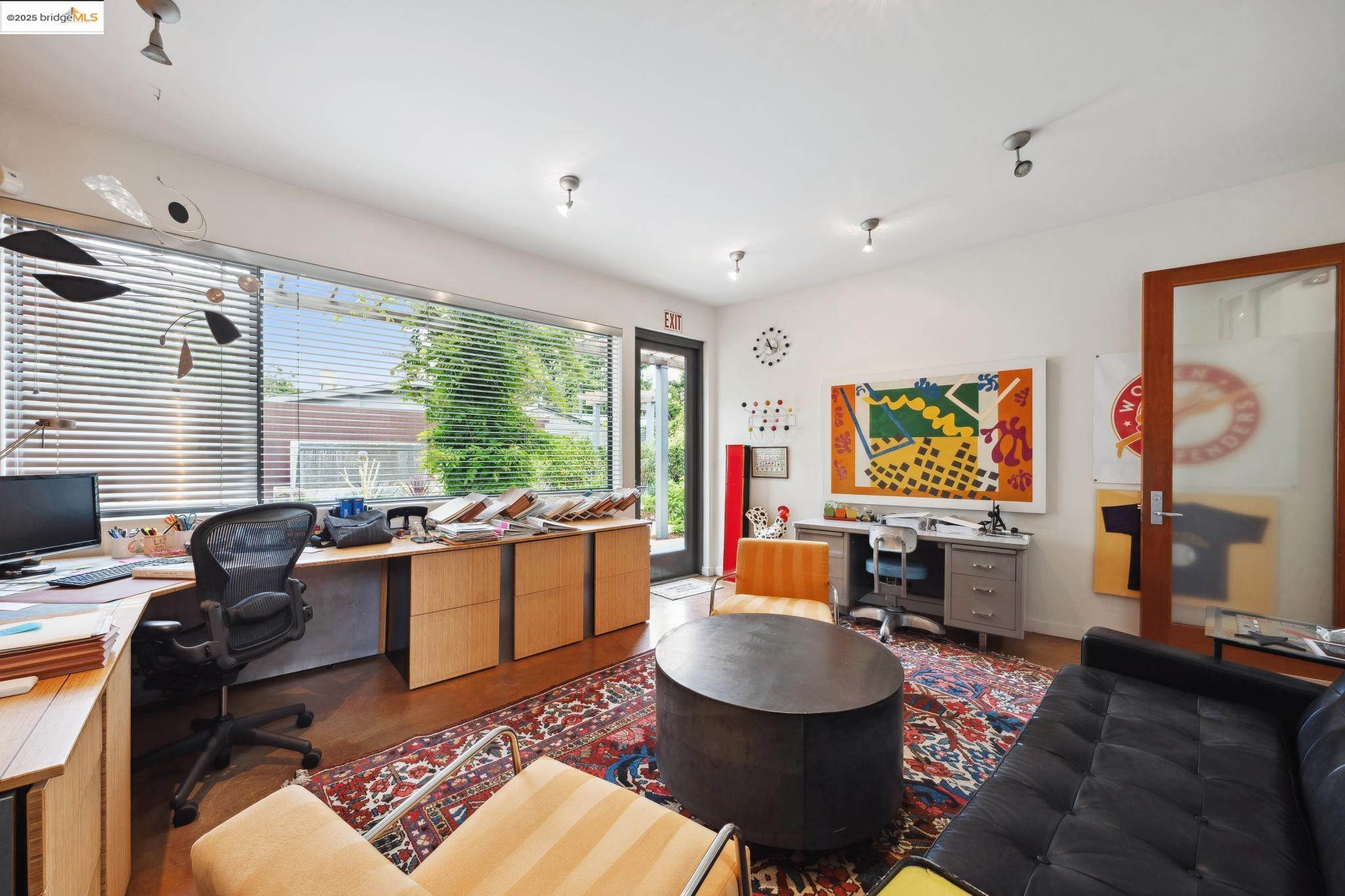 1010 Grayson Street Berkeley, CA 94710 - Photo 11 of 35 a living room with fireplace furniture and a flat screen tv