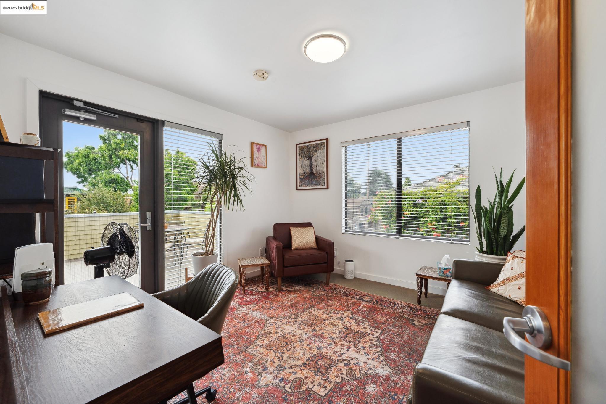 1010 Grayson Street Berkeley, CA 94710 - Photo 15 of 35 a living room with furniture and a large window