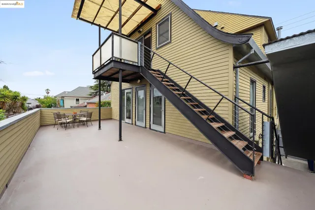 a view of a terrace with chairs and a potted plant