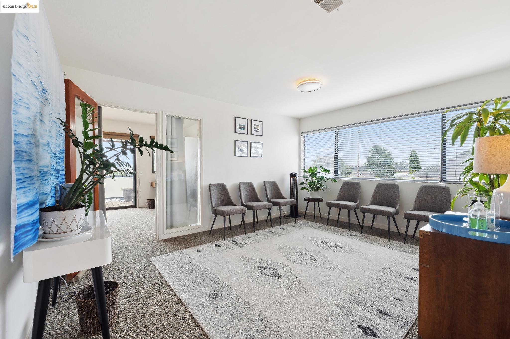 1010 Grayson Street Berkeley, CA 94710 - Photo 21 of 35 a living room with furniture large window and wooden floor