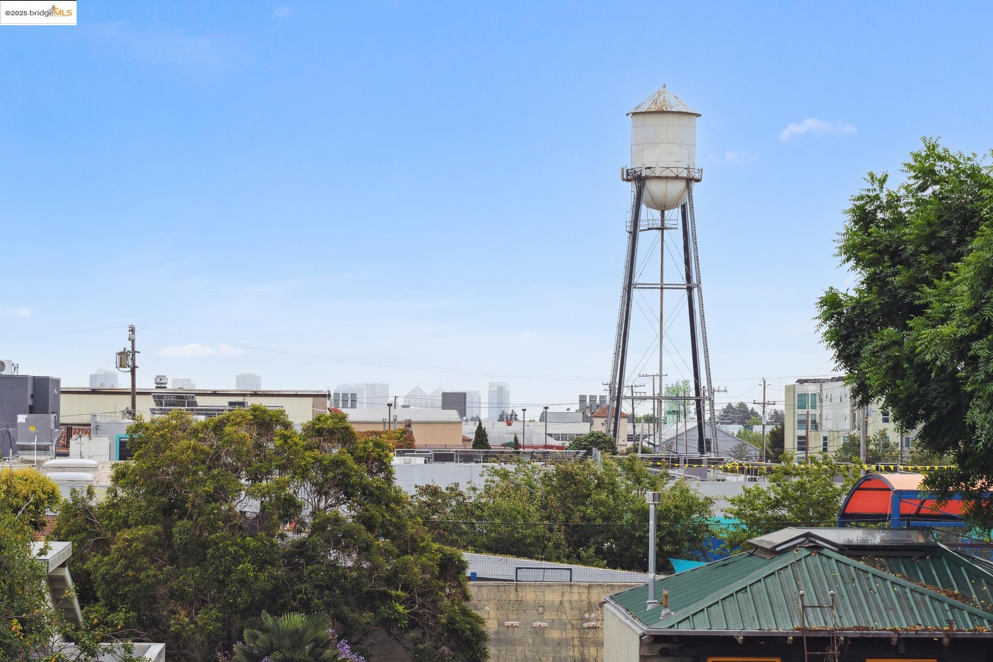 1010 Grayson Street Berkeley, CA 94710 - Photo 28 of 35 a front view of a residential apartment building with a yard