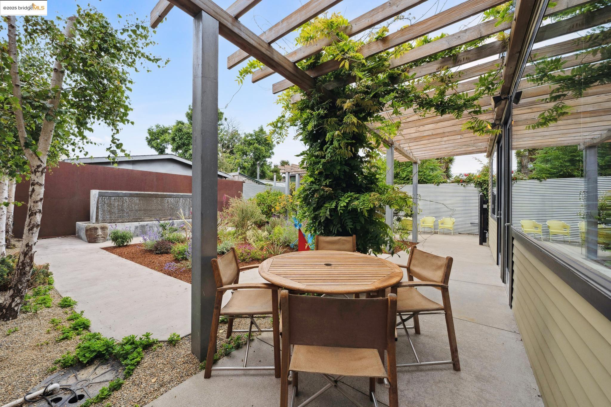 1010 Grayson Street Berkeley, CA 94710 - Photo 33 of 35 a view of a patio with table and chairs and potted plants