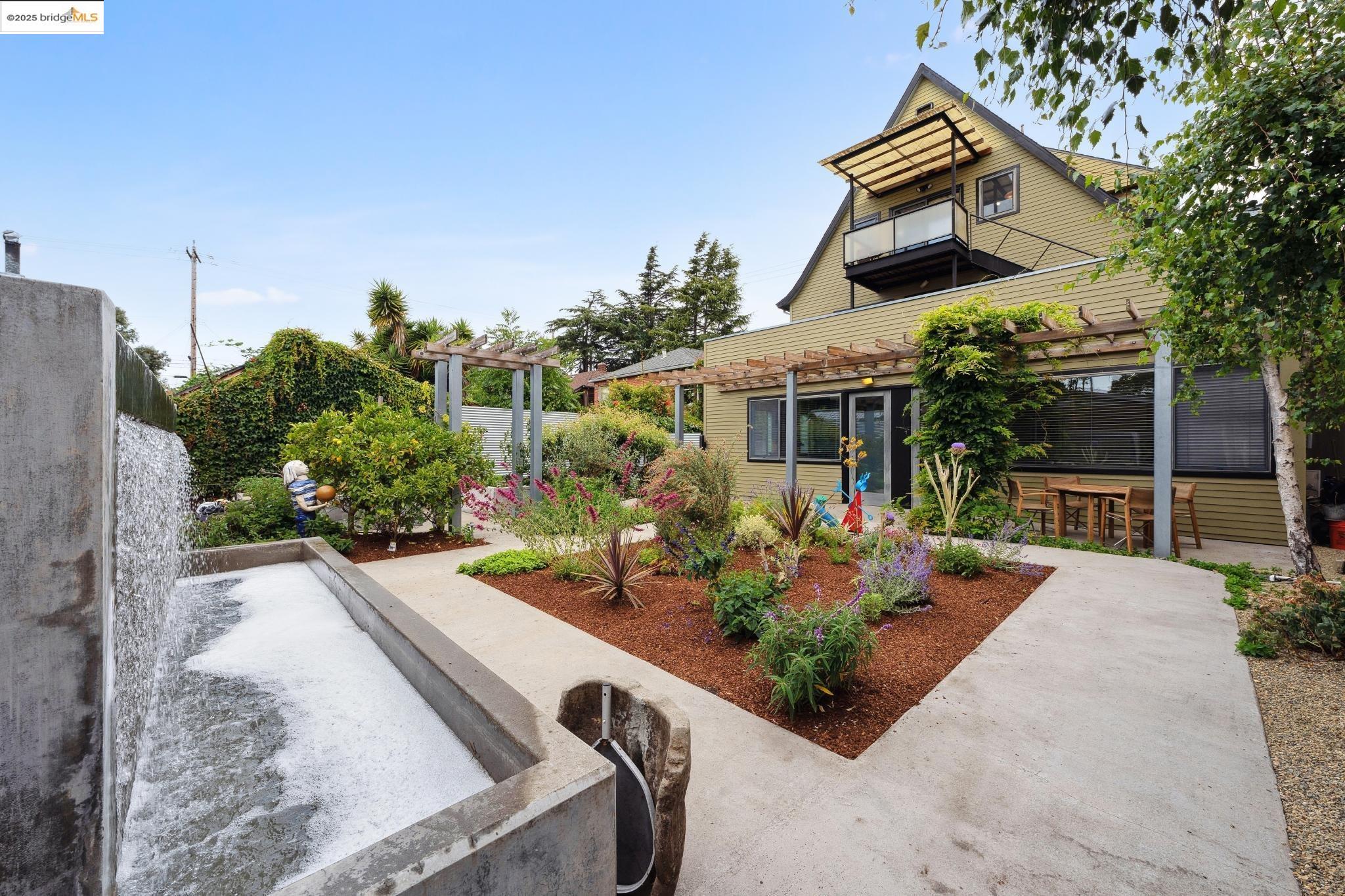 1010 Grayson Street Berkeley, CA 94710 - Photo 34 of 35 front view of house with a yard and potted plants