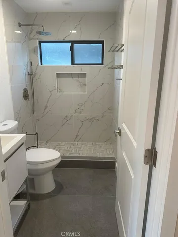 a view of a bathroom from a hallway