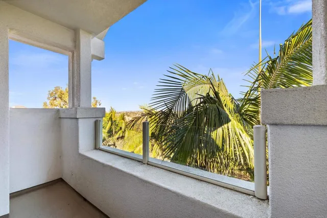 a view of walk in closet with clothes