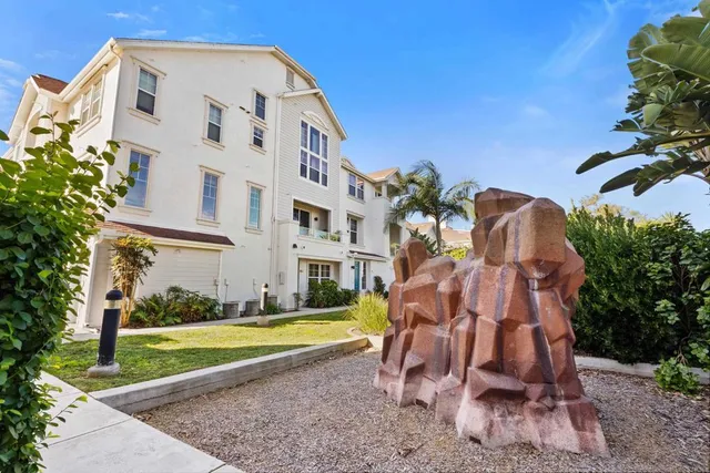 a view of a building with a yard