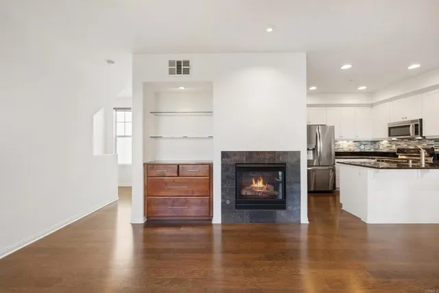 a view of kitchen with furniture and wooden floor