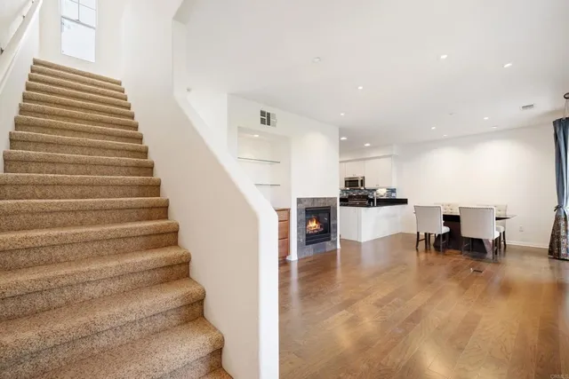 a view of kitchen with dining area and windows