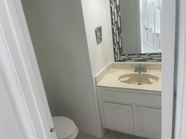 a bathroom with a sink and toilet