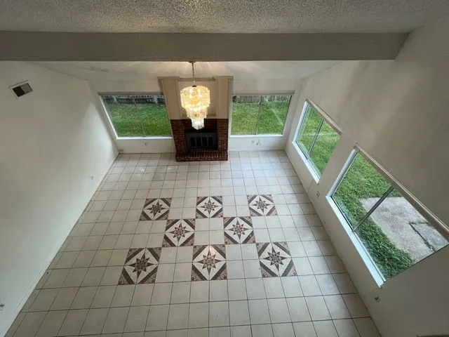 a view of living room with furniture and a window