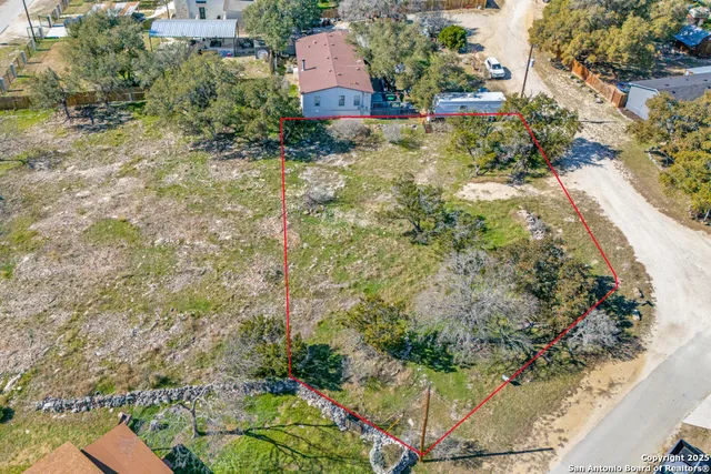 an aerial view of residential house with an outdoor space
