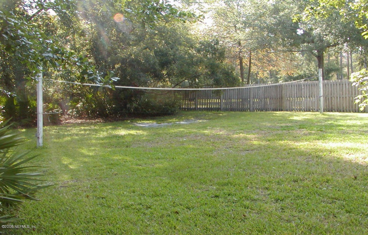 4711 Raggedy Point Road Orange Park, FL 32003 - Photo 11 of 15 Back yard with volleyball court.