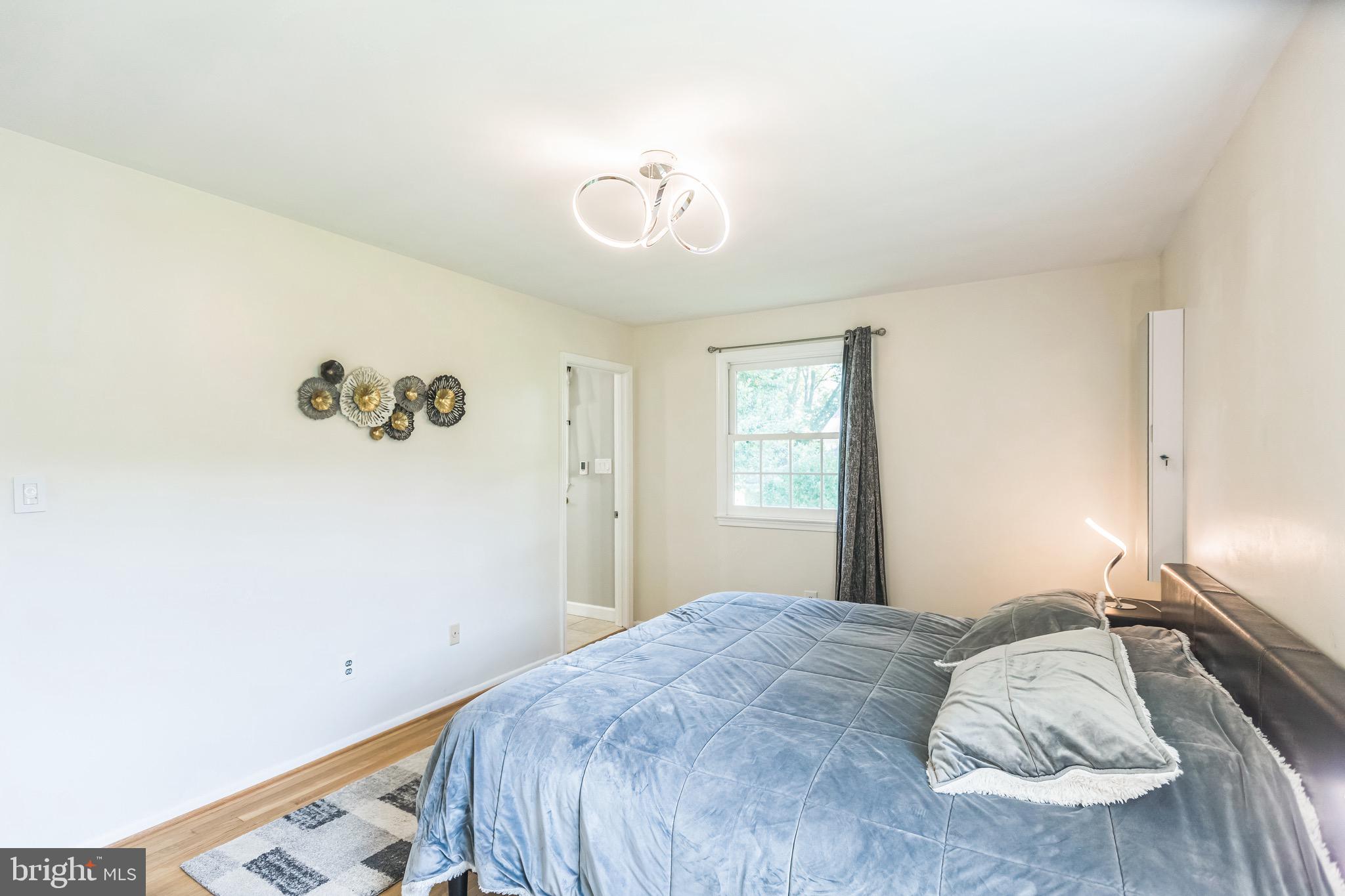 4008 Briars Road Olney, MD 20832 - Photo 16 of 32 a bedroom with a bed and a window