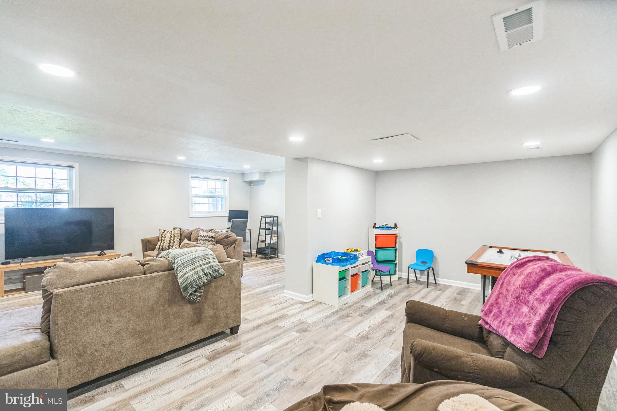 4008 Briars Road Olney, MD 20832 - Photo 25 of 32 a living room with furniture and a couch