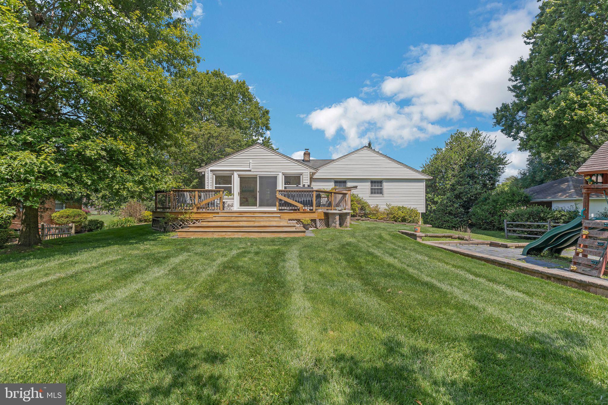 4008 Briars Road Olney, MD 20832 - Photo 29 of 32 a front view of a house with a yard table and chairs