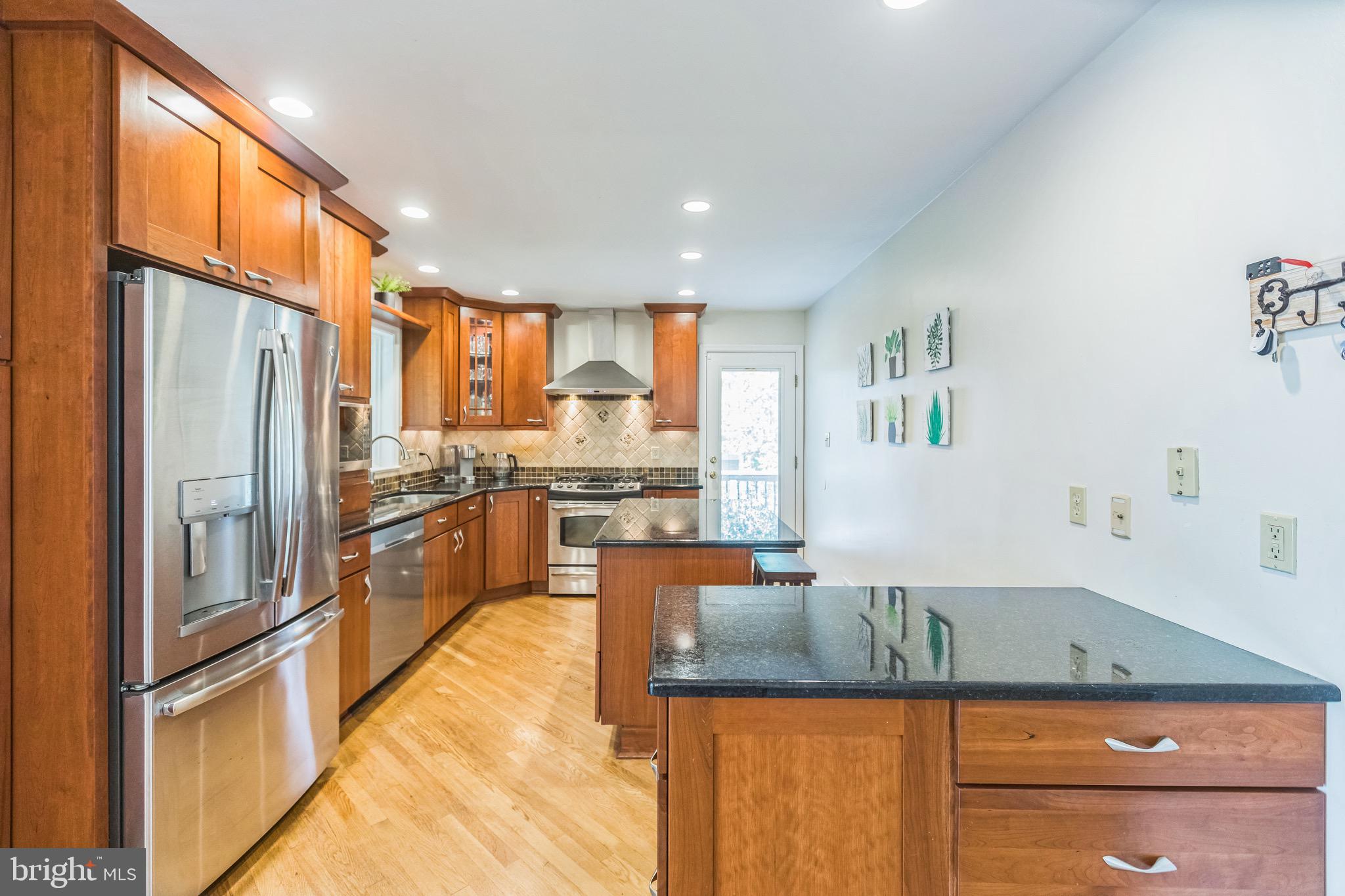 4008 Briars Road Olney, MD 20832 - Photo 6 of 32 a kitchen with stainless steel appliances granite countertop a refrigerator and a stove
