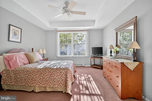 a bed room with a bed and a television