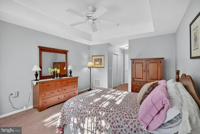 a bed room with a bed and a dresser