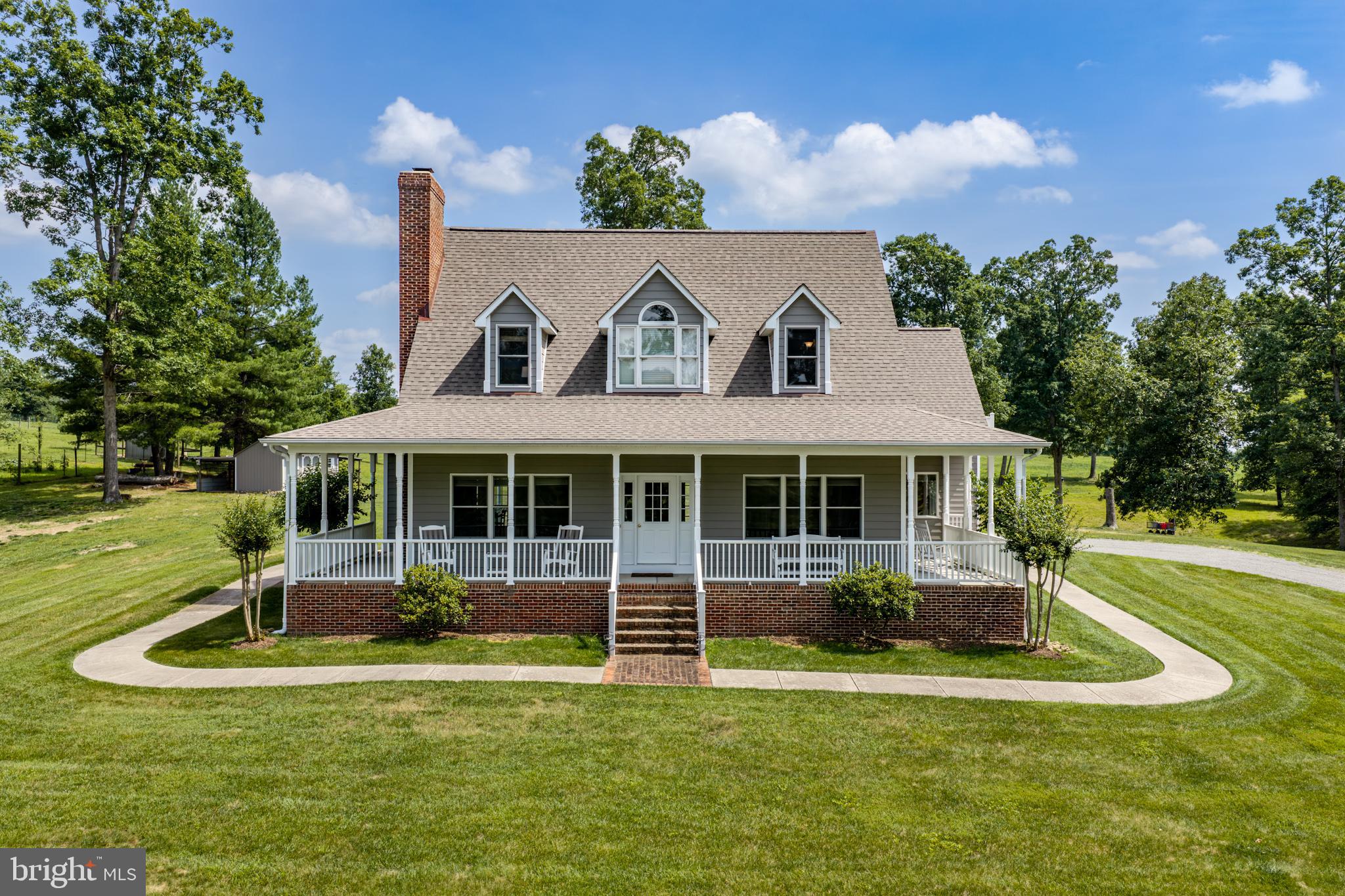 1688 Desert Road Reva, VA 22735 - Photo 5 of 81 a front view of a house with a yard table and chairs