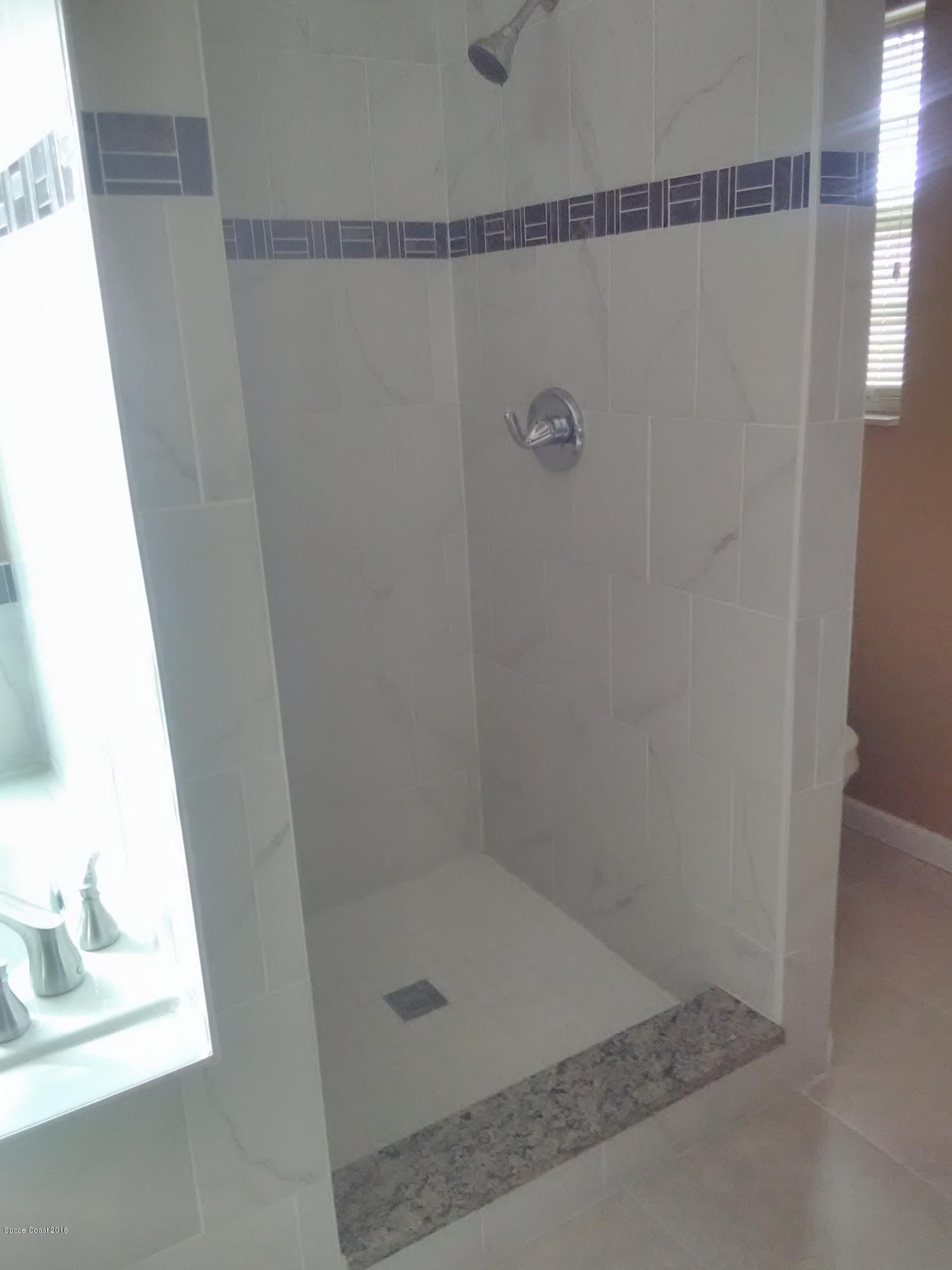 231 Rheine Road Northwest Palm Bay, FL 32907 - Photo 7 of 10 a bathroom with a shower