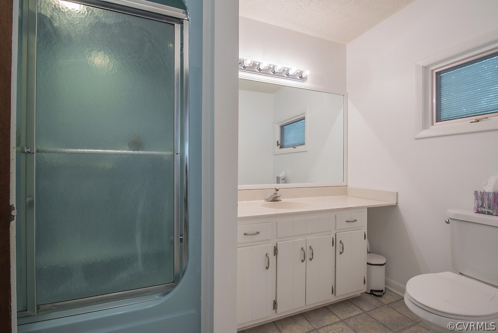 14200 Long Gate Road Midlothian, VA 23112 - Photo 21 of 27 a bathroom with a toilet a sink a mirror and vanity