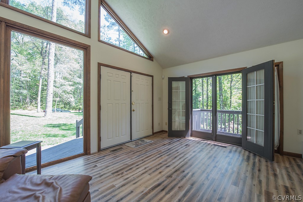 14200 Long Gate Road Midlothian, VA 23112 - Photo 3 of 27 a view of an empty room with wooden floor and a window