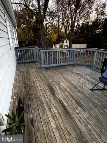 a view of deck with wooden floor and outdoor seating
