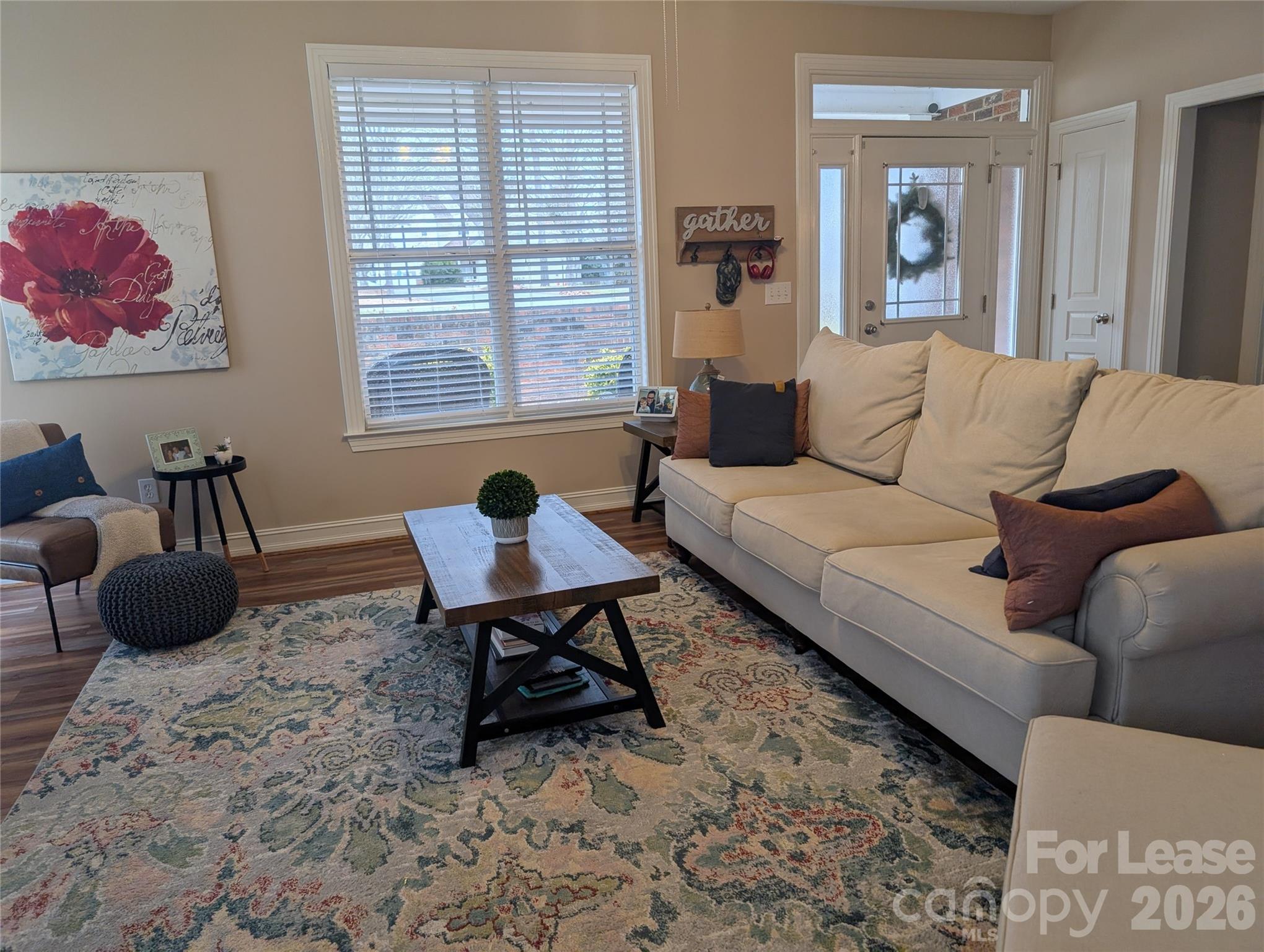20207 Colony Point Lane Cornelius, NC 28031 - Photo 5 of 26 a living room with furniture and a window