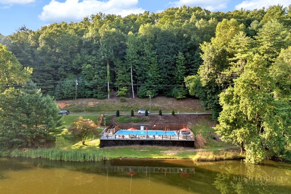 467 Horseshoe Ridge Road East Deep Gap, NC 28618 - Photo 39 of 46 a view of a lake with house