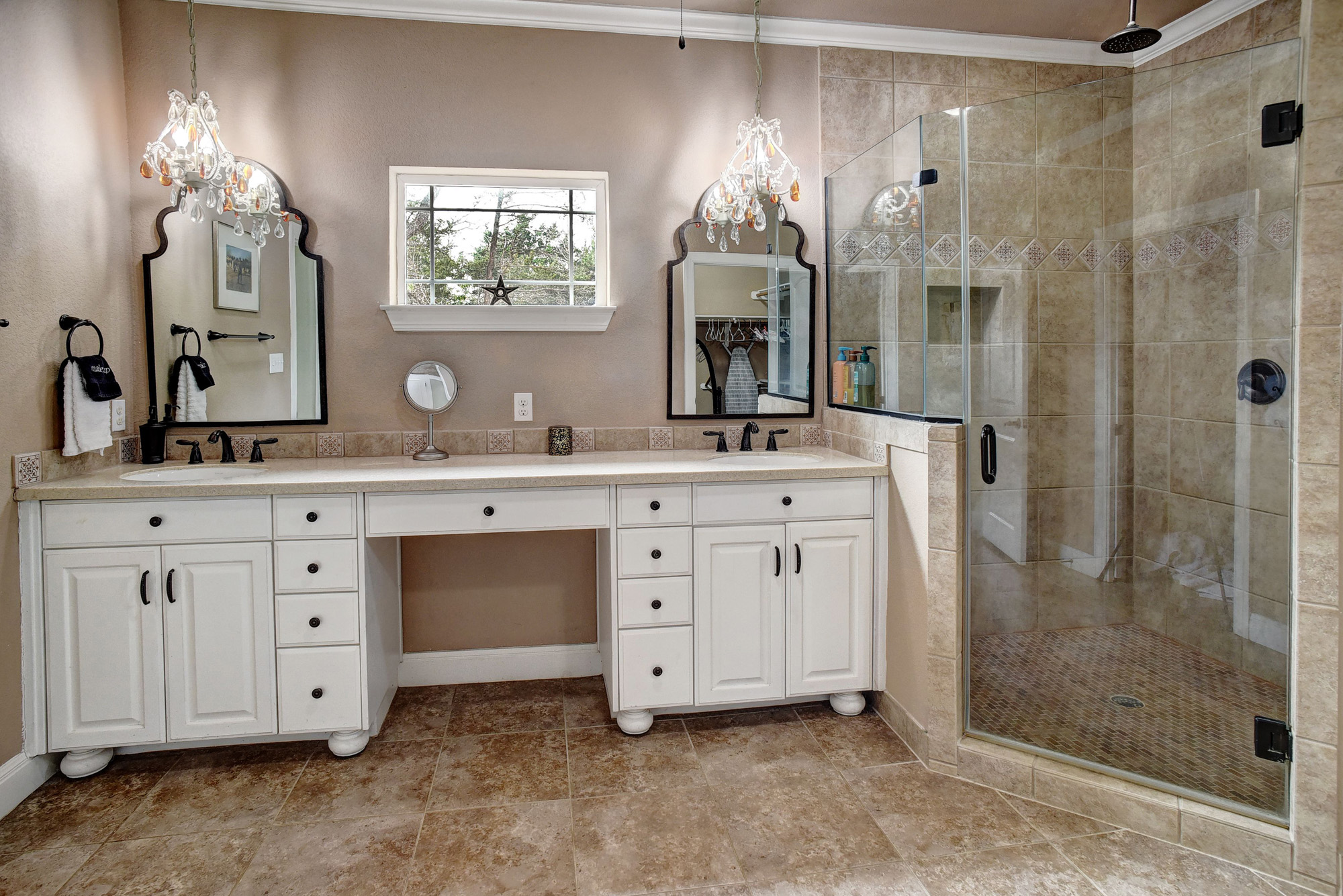 418 Vyvjala Road Smithville, TX 78957 - Photo 15 of 40 Full bath with double vanity, a stall shower, ornamental molding, and a chandelier