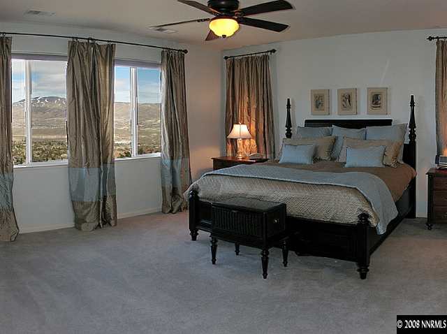 4871 Grousecreek Court Reno, NV 89519 - Photo 6 of 9 a bedroom with a bed and a window
