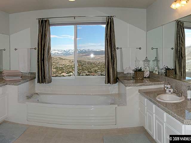 4871 Grousecreek Court Reno, NV 89519 - Photo 7 of 9 a bathroom with a sink a bathtub and next to a window