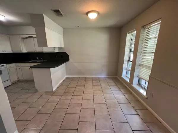 a view of a kitchen with a sink
