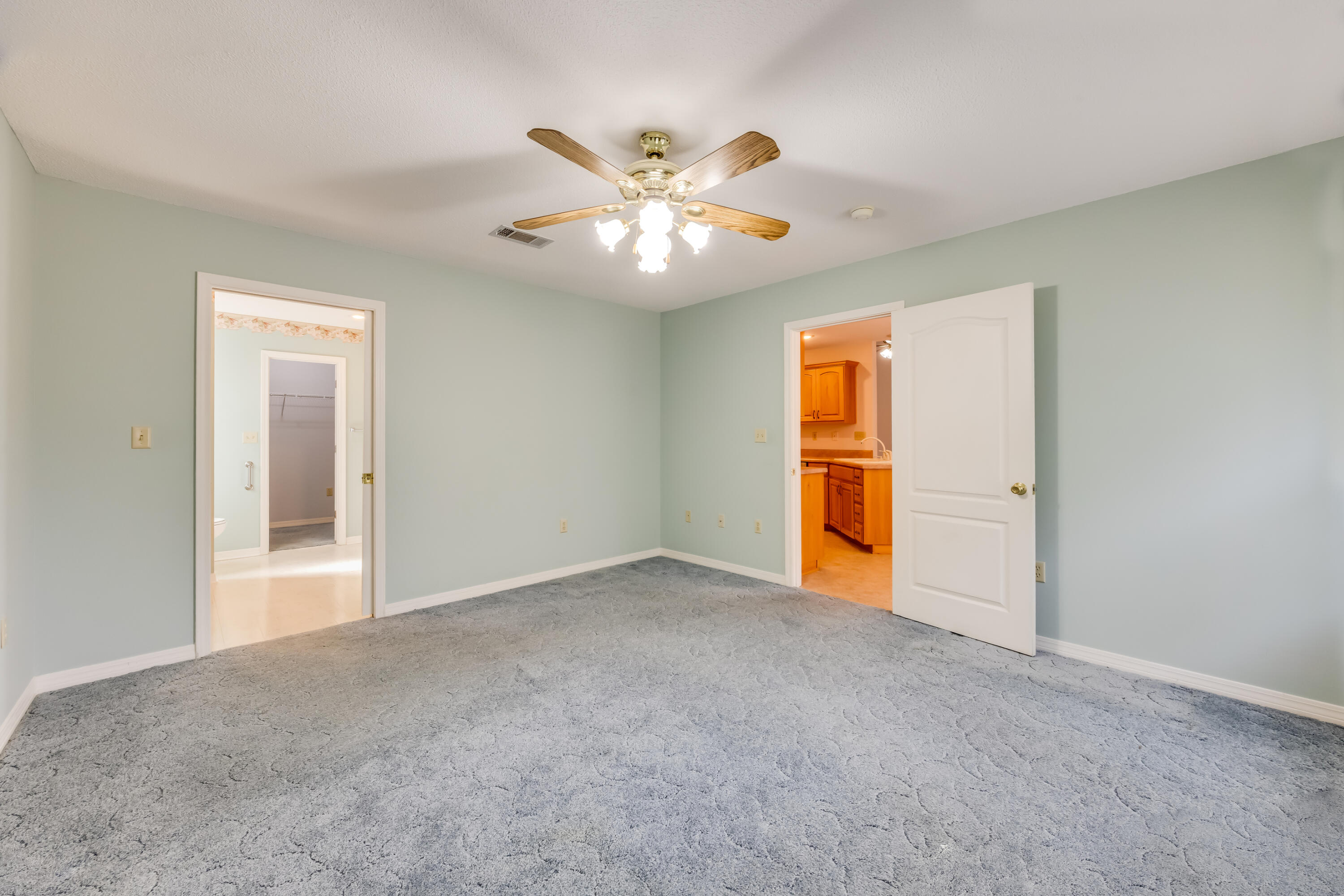 5965 Oak Hill Road Crestview, FL 32536 - Photo 17 of 44 a view of an empty room with window and chandelier fan