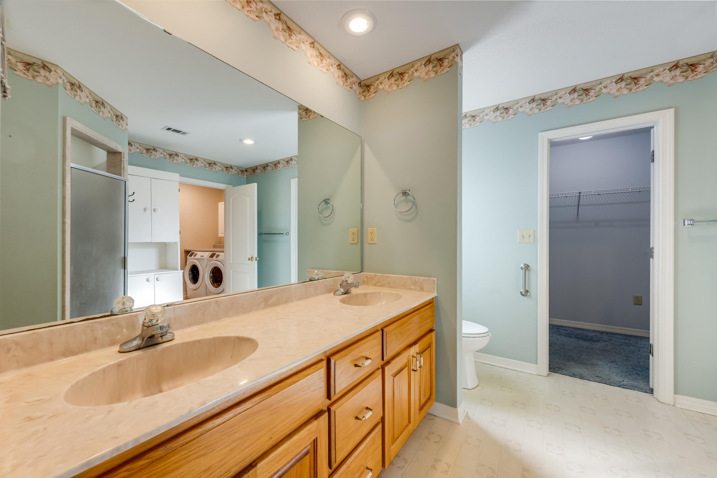 5965 Oak Hill Road Crestview, FL 32536 - Photo 19 of 44 a spacious bathroom with a granite countertop sink mirror and double