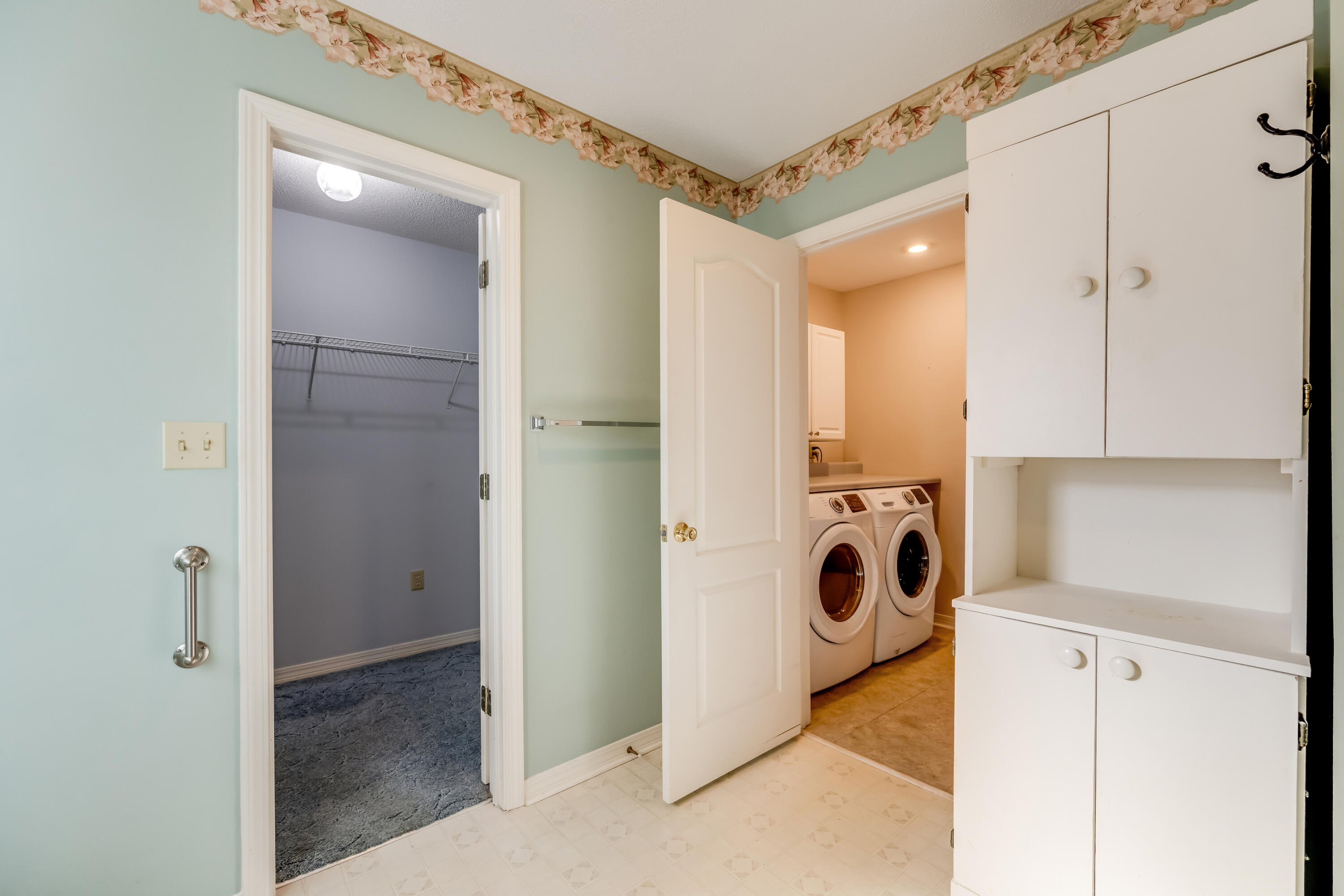 5965 Oak Hill Road Crestview, FL 32536 - Photo 22 of 44 a view of a storage & utility room with a washer and dryer