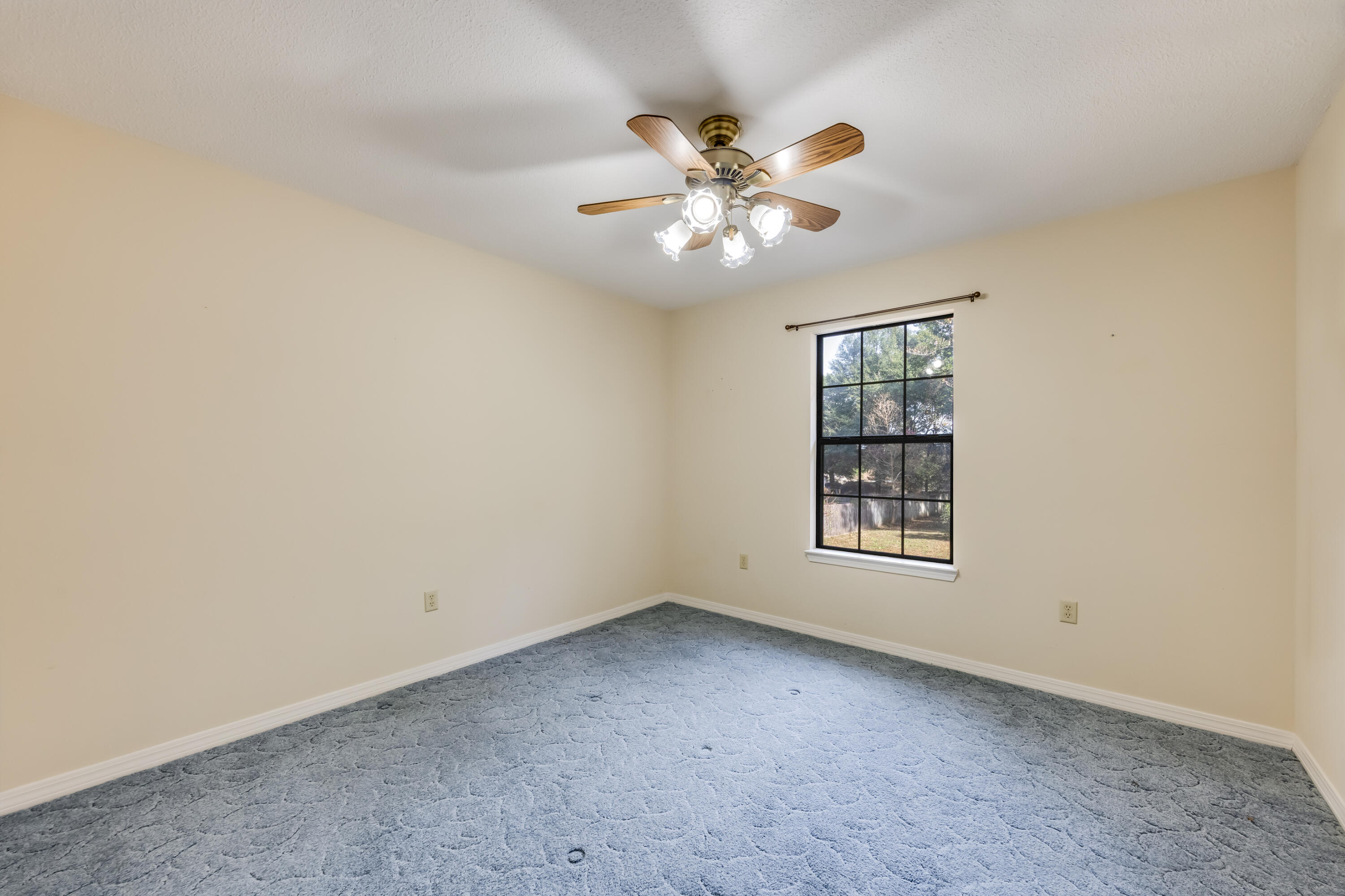 5965 Oak Hill Road Crestview, FL 32536 - Photo 24 of 44 an empty room with a window and a fan
