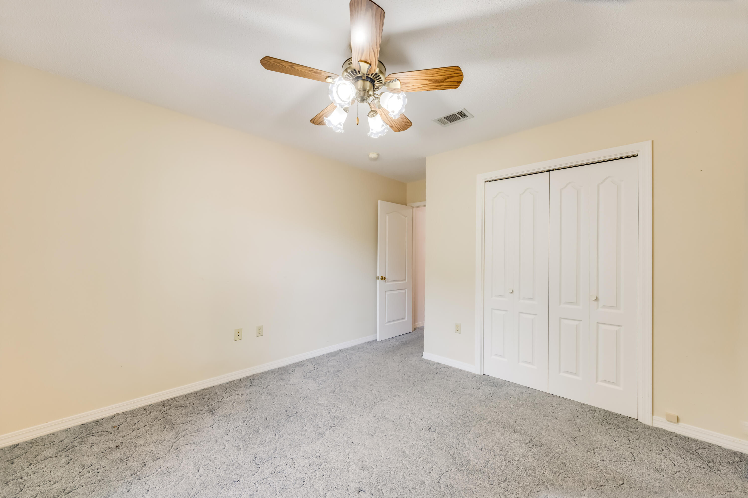 5965 Oak Hill Road Crestview, FL 32536 - Photo 25 of 44 a view of an empty room with a fan