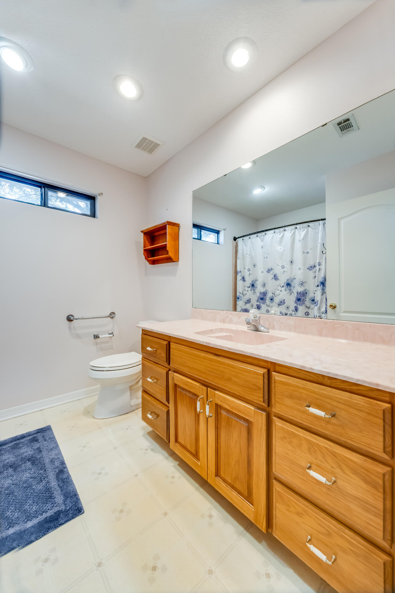 5965 Oak Hill Road Crestview, FL 32536 - Photo 28 of 44 a spacious bathroom with a tub sink vanity and mirror