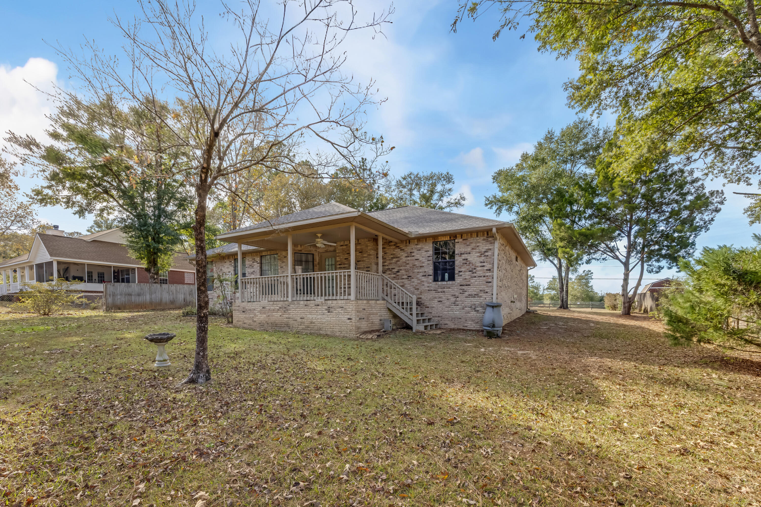 5965 Oak Hill Road Crestview, FL 32536 - Photo 37 of 44 a front view of a house with a garden