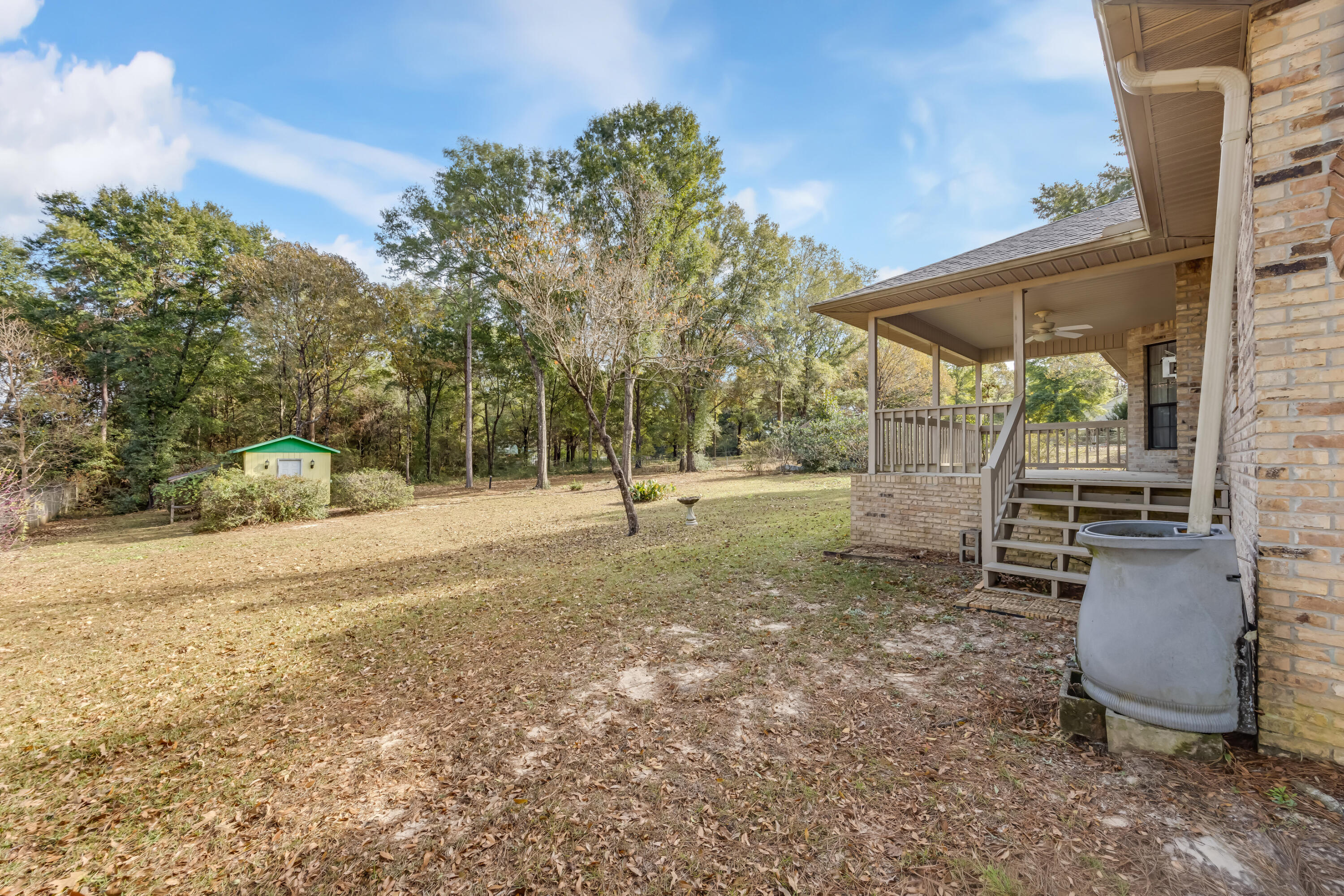 5965 Oak Hill Road Crestview, FL 32536 - Photo 38 of 44 a view of a yard with a tree